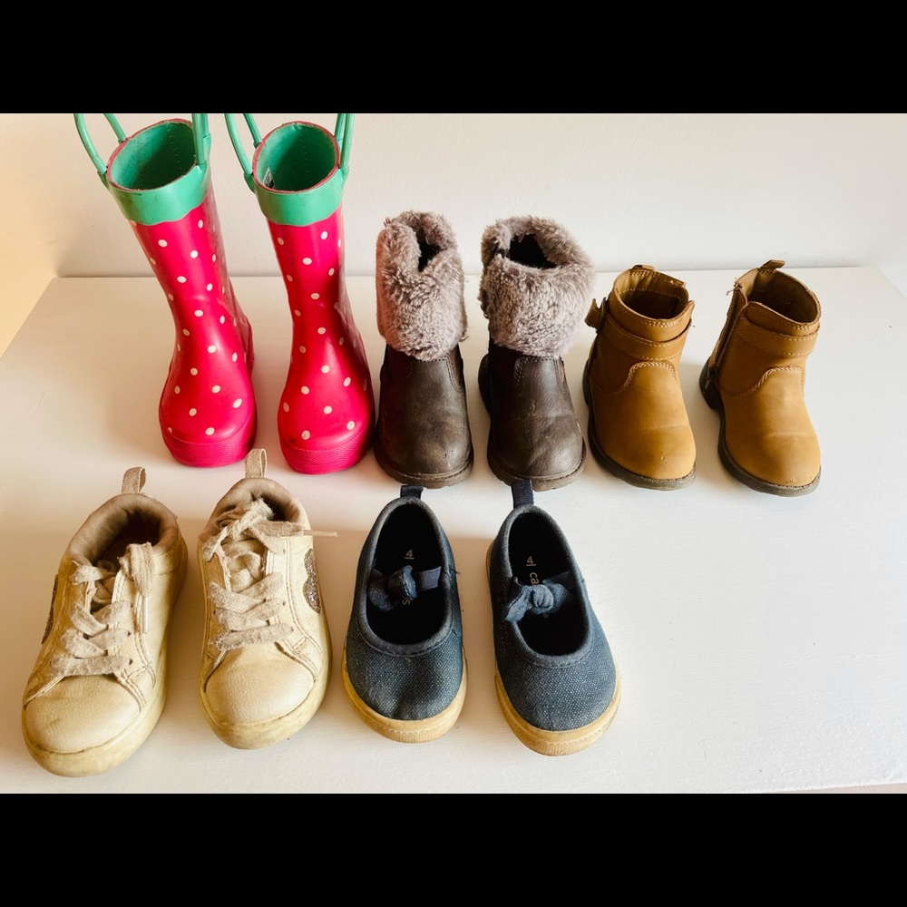 The 3 pairs of boots and the white sneakers are size 5. Blue pair is a size 4.